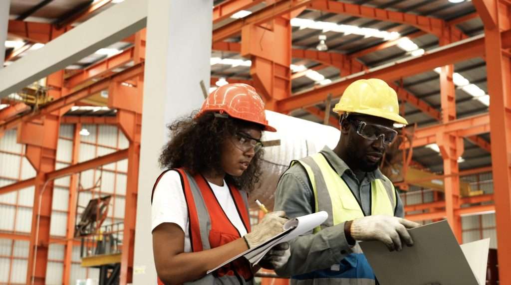 two warehouse workers walk and talking | speedrack west